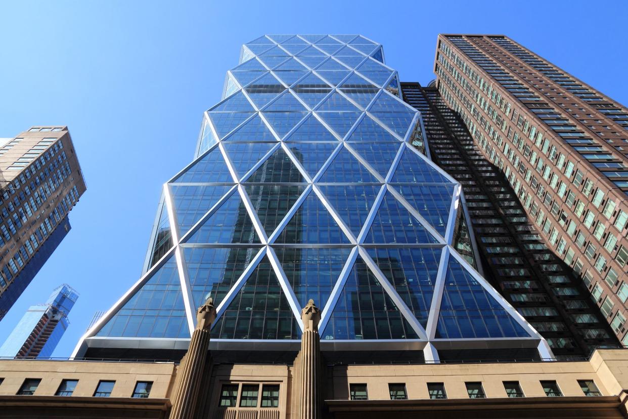 New York, United States - July 6, 2013: Hearst Tower skyscraper in New York. The building is 182m tall and is the world headquarters of Hearst Corporation.