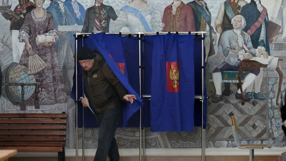 A man leaves a voting booth at a polling station in St. Petersburg, March 16, 2024. - Dmitri Lovetsky/AP