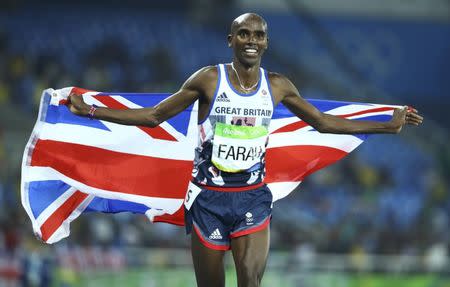 2016 Rio Olympics - Athletics - Final - Men's 5000m Final - Olympic Stadium - Rio de Janeiro, Brazil - 20/08/2016. Mo Farah (GBR) of Britain celebrates winning the gold. REUTERS/Lucy Nicholson