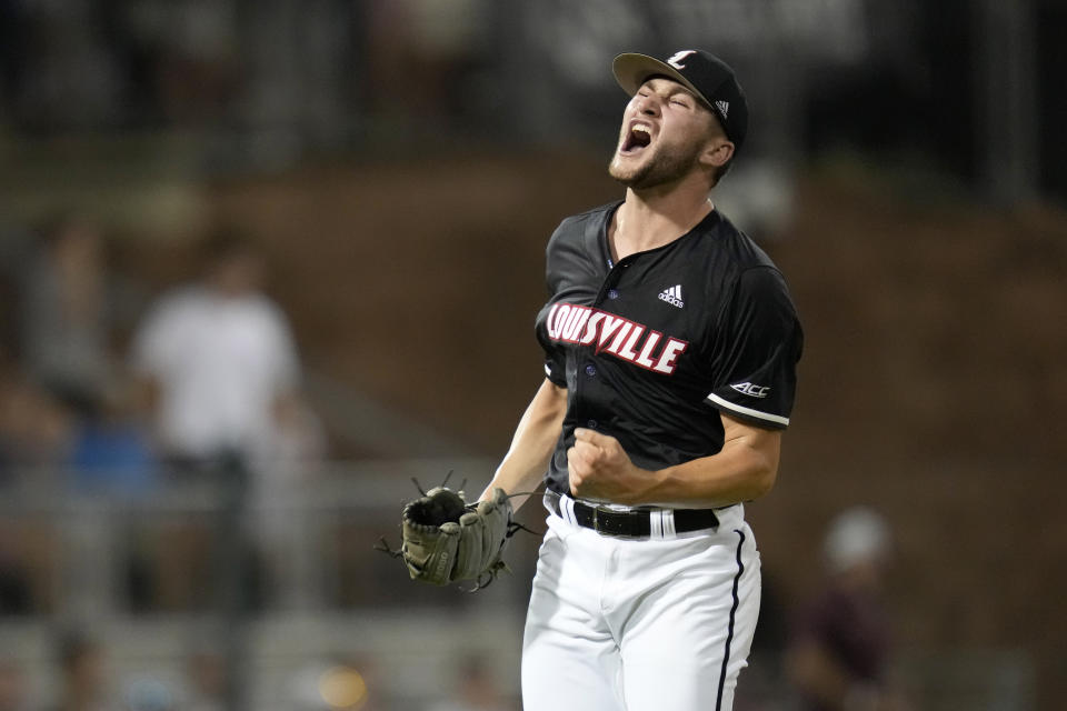 Louisville pitcher Tate Kuehner reacts after striking out two Texas A&M batters in a row with the bases loaded to end the sixth inning during an NCAA college baseball super regional tournament game Friday, June 10, 2022, in College Station, Texas. (AP Photo/Sam Craft)