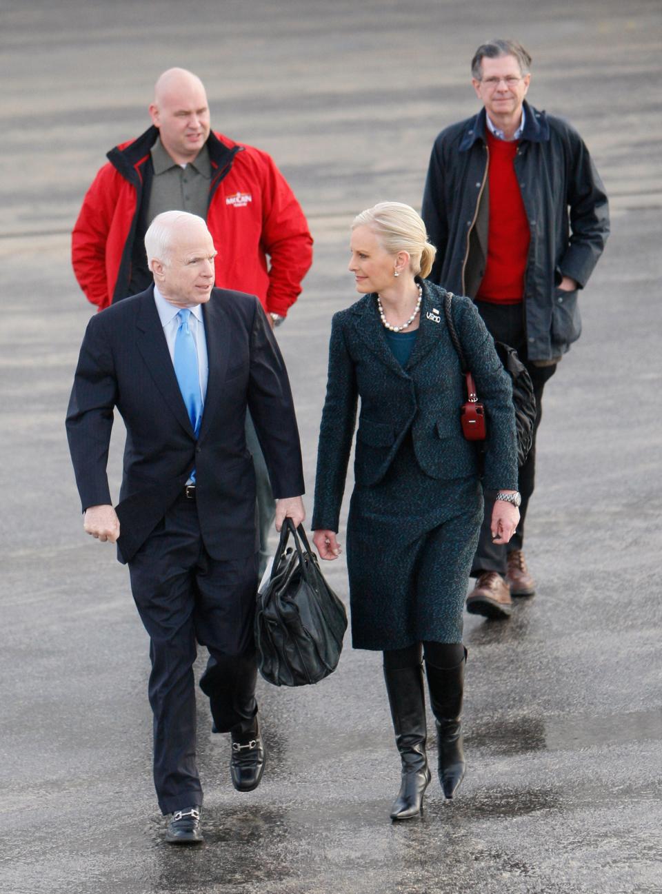 Charlie Black, far right, walks with Sen. John McCain, R-Ariz., his wife Cindy, and campaign adviser Steve Schmidt on Jan. 9, 2008, in New Hampshire.