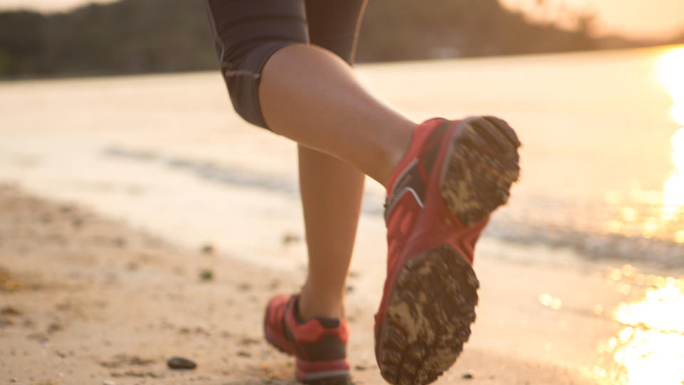 Close up of a runner's shoes on the beach