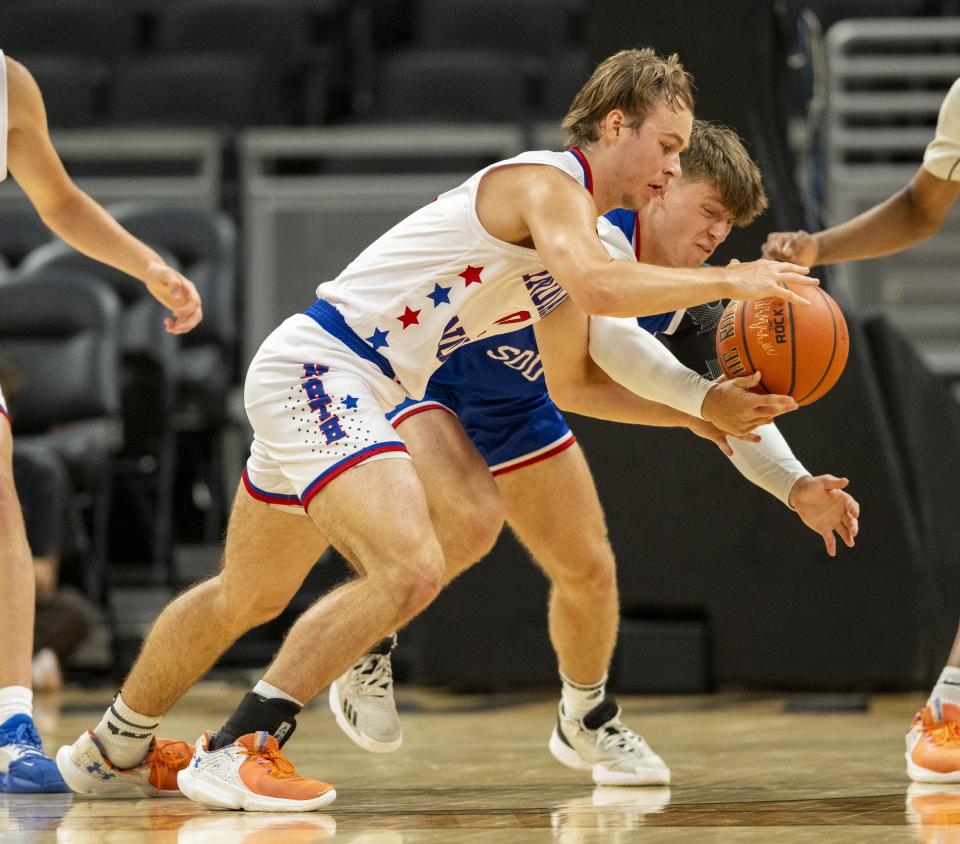 North Future All-Star Isaac Andrews (0), a junior from Wapahani High School, left, and South Future All-Star Josiah Dunham (5), a junior from Evansville Christian High School, battle for the ball during the second half of an boysâ€™ Indiana High School Future All-Stars basketball game, Saturday, June 10, 2023, at Gainbridge Fieldhouse, in Indianapolis.