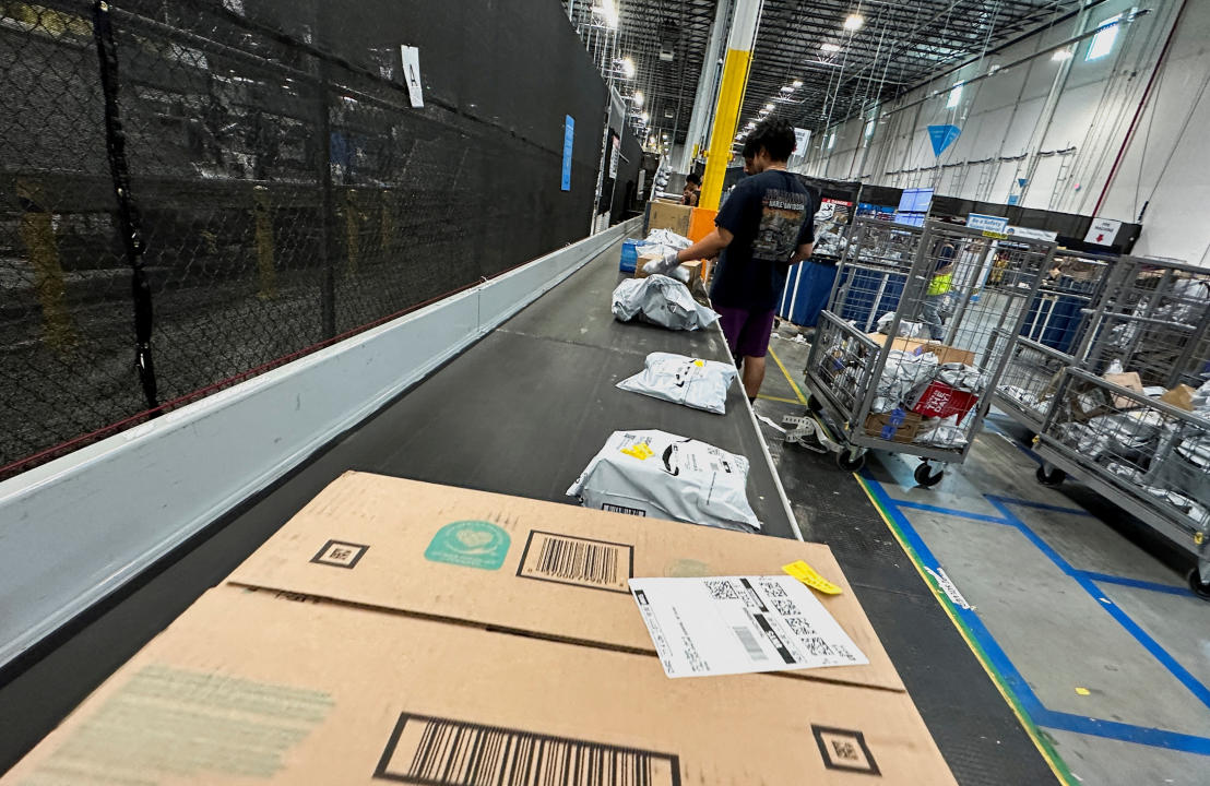 People work at the Amazon warehouse, busy on Prime Day, in Melville, New York, U.S., July 11, 2023. REUTERS/Soren Larson   REFILE - CORRECTING MONTH