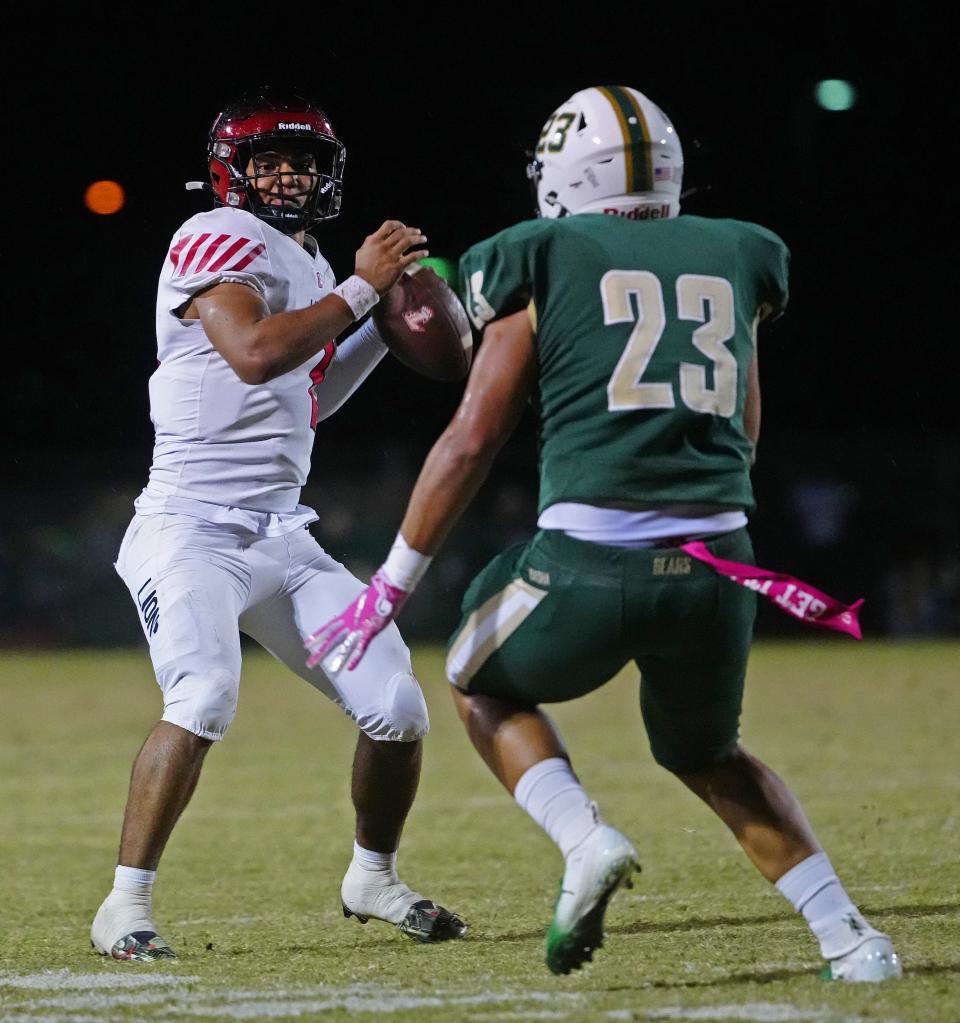 Liberty quarterback Navi Bruzon (7) throws a pass under pressure from Basha linebacker Wyatt Milkovic (23) during a game at Basha in Chandler on Oct. 7, 2022.