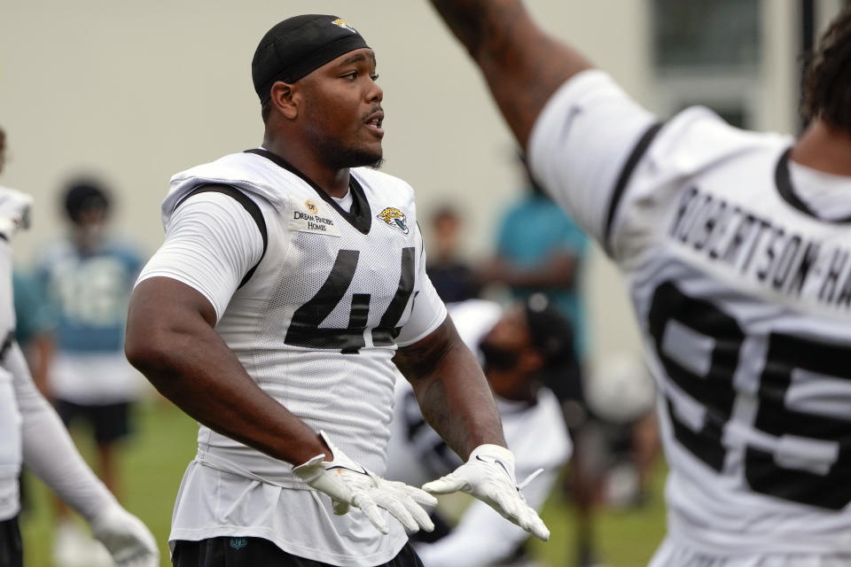 Jacksonville Jaguars linebacker Travon Walker (44) warms up during a practice at the NFL football team's training camp, Monday, July 31, 2023, in Jacksonville, Fla. (AP Photo/John Raoux)