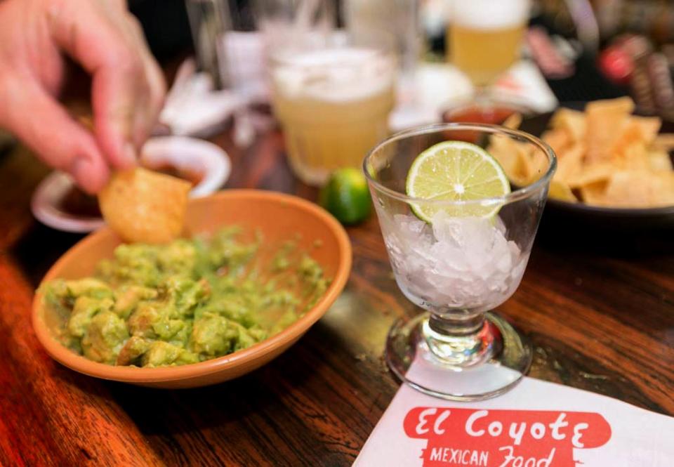 In this Monday, April 28, 2014 photo, a small glass is presented with a lime requested to flavor a guacamole appetizer at the bar of El Coyote, a Mexican restaurant in Los Angeles. Thousands of restaurateurs from coast to coast who have fallen victim to the Great Green Citrus Crisis of 2014. The price of a lime has skyrocketed in recent weeks, quadrupling or, in some areas, going even higher. (AP Photo)