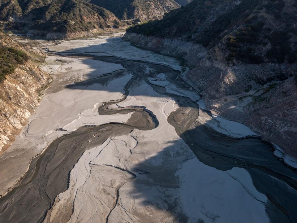 The drought turned the San Gabriel reservoir lake bed to dust