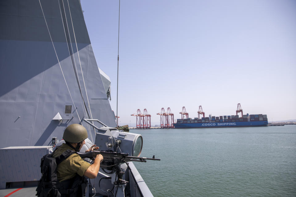 An Israeli Navy sailor mans his weapon on board the Israeli Navy Ship Atzmaut, in the Mediterranean Sea, Wednesday, Sept. 1, 2021. One of the navy’s most important responsibilities is protecting Israel’s natural gas platforms in the Mediterranean Sea, which now provide some 75% of the country’s electricity. (AP Photo/Ariel Schalit)