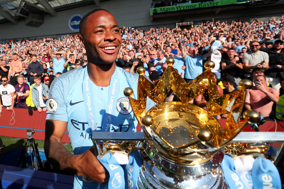 BRIGHTON, ENGLAND - MAY 12: Raheem Sterling of Manchester City celebrates with the Premier League Trophy after winning the title following the Premier League match between Brighton & Hove Albion and Manchester City at American Express Community Stadium on May 12, 2019 in Brighton, United Kingdom. (Photo by Victoria Haydn/Man City via Getty Images)