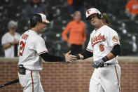 Baltimore Orioles' Ryan Mountcastle (6) is greeted by Austin Hays (21) after hitting a solo home run against Texas Rangers starting pitcher Glenn Otto during the fifth inning of a baseball game Thursday, Sept. 23, 2021, in Baltimore. (AP Photo/Terrance Williams)