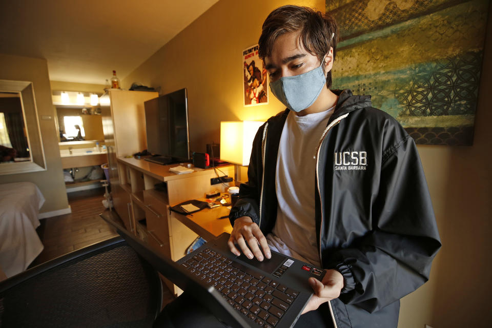 UCSB student Zac McGlynn works on his laptop in his room.