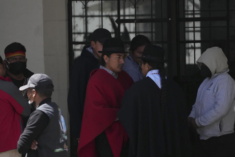 Indigenous leader Leonidas Iza, center, waits with members of his delegation at the Basilica del Voto Nacional where dialogue with the government broke down in downtown Quito, Ecuador, Tuesday, June 28, 2022. Ecuadorian President Guillermo Lasso announced a cut in gasoline prices Sunday that fell short of the reduction demanded by Indigenous leaders to end a strike that has paralyzed parts of the country for two weeks. (AP Photo/Dolores Ochoa)