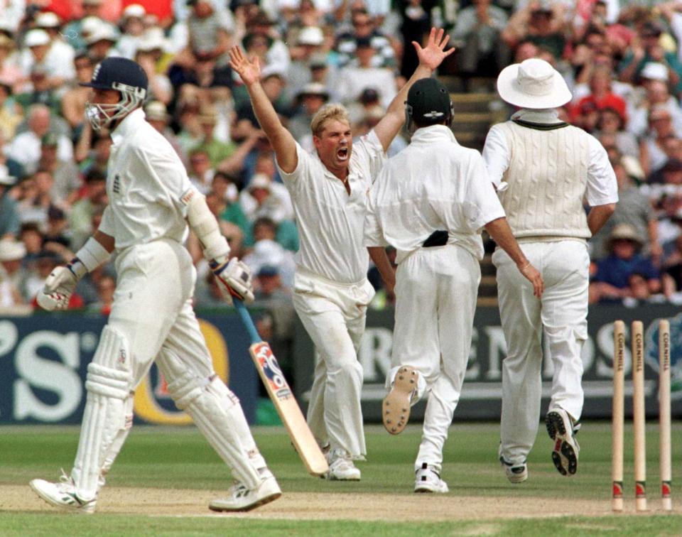 3rd Test Match-England v Australia at Old Trafford: Australian bowler Shane Warne celebrates bowling Alec Stewart (departing left) for one at Old Trafford today (Sunday). PA Photo by Owen Humphreys.   (Photo by Owen Humphreys - PA Images/PA Images via Getty Images)