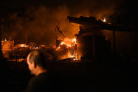 <p>Scott Whitley watches as the Ponderosa fire burns a garage at his residence east of Oroville, Calif., Aug. 29, 2017. (Photo: Noah Berger/Reuters) </p>