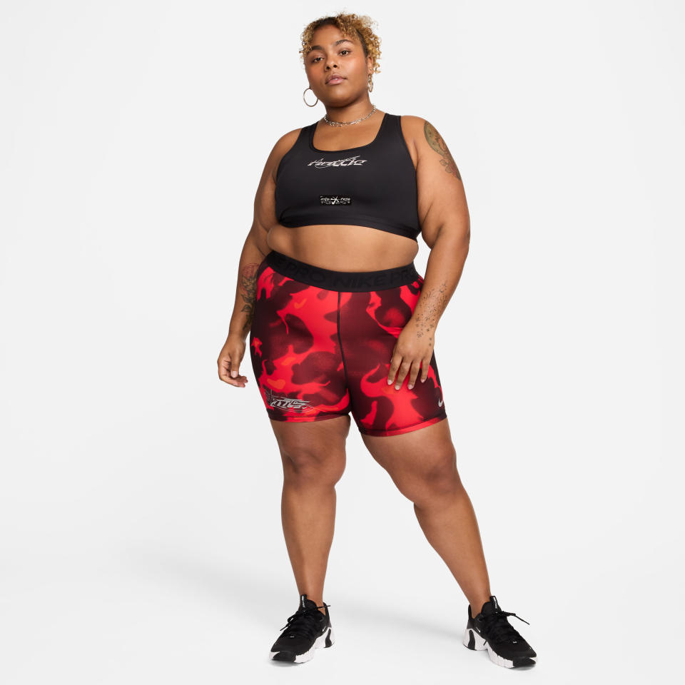 Model wearing a sports bra and Nike biker shorts from Megan Thee Stallion's 