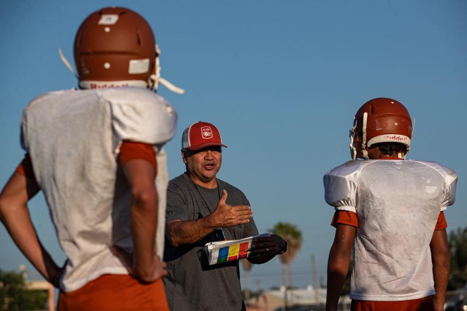 Alice head football coach JR Castellano leads practice at the high school on Aug. 2, 2023, in Alice, Texas.