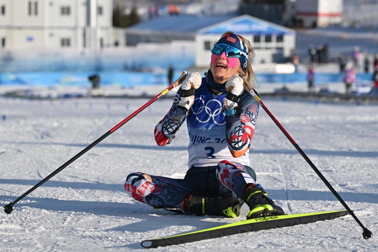 Norway's Therese Johaug celebrates after winning the women's skiathlon 2x7,5km event during the Beijing 2022 Winter Olympic Games on February 5, 2022, at the Zhangjiakou National Cross-Country Skiing Centre. (Photo by Jewel SAMAD / AFP) (Photo by JEWEL SAMAD/AFP via Getty Images)