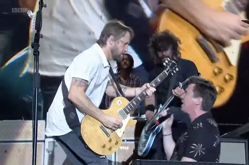 Rick Astley performs with Foo Fighters at Reading Festival 2019