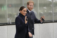 Meghan Markle and Prince Harry pose for pictures after visiting the observatory in One World Trade in New York, Thursday, Sept. 23, 2021. The Duke and Duchess of Sussex got a hawk's-eye view of New York City with a visit to the rebuilt World Trade Center's signature tower. (AP Photo/Seth Wenig)