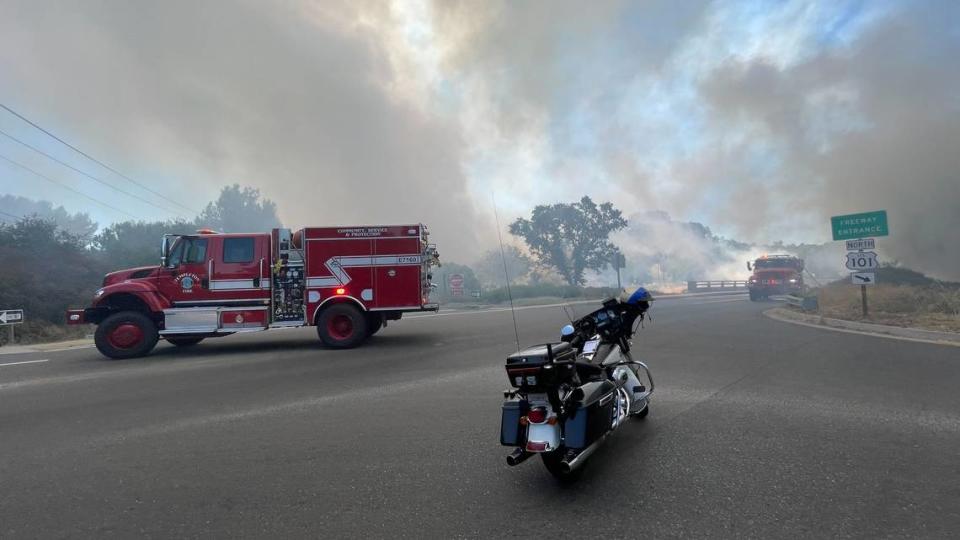 Smoke billows over San Anselmo Road in Atascadero as firefighters respond to the vegetation fire along Highway 101 on July 15, 2023. Joe Tarica/jtarica@thetribunenews.com