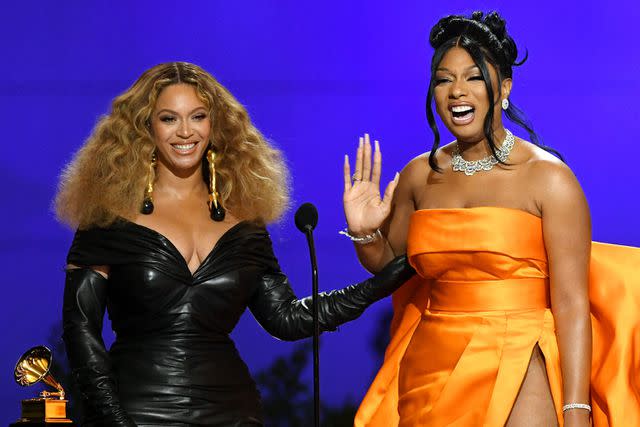 <p>Kevin Winter/Getty</p> Beyoncé and Megan Thee Stallion at the 2021 Grammy Awards