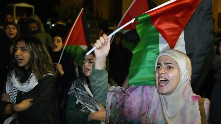 Demonstrators chant slogans during a protest in solidarity with the Palestinian people in Gaza, at Martyrs’ Square in downtown Beirut, Lebanon, Tuesday, Oct. 17, 2023. Groups of protesters roamed the city on motorcycles and gathered outside the French embassy, and the headquarters of the U.N. Economic and Social Commission for Western Asia. They were unable to reach the heavily fortified U.S. embassy compound in the hills north of Beirut. (AP Photo/Bilal Hussein)