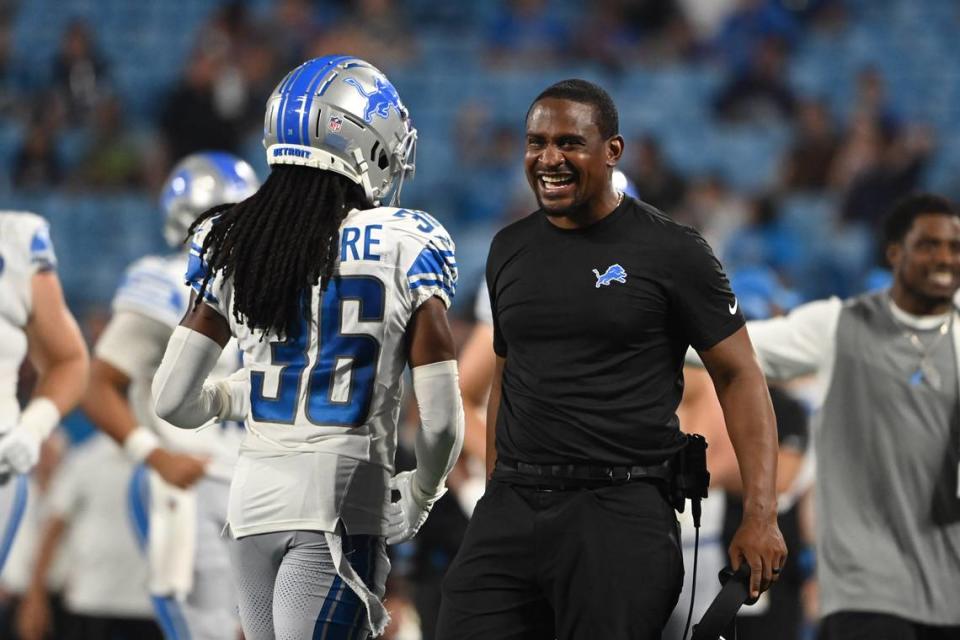 Aug 25, 2023; Charlotte, North Carolina, USA; Detroit Lions cornerbacks coach Dre Bly reacts with cornerback Steven Gilmore (36) after Carolina Panthers turn the ball over in the fourth quarter at Bank of America Stadium. Mandatory Credit: Bob Donnan-USA TODAY Sports