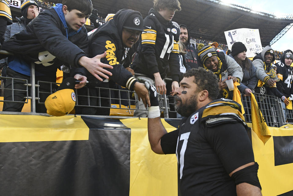 Pittsburgh Steelers defensive tackle Cameron Heyward greets fans as he heads to the locker room following an NFL football game against the Cleveland Browns in Pittsburgh, Sunday, Jan. 8, 2023. The Steelers won 28-14. (AP Photo/Don Wright)