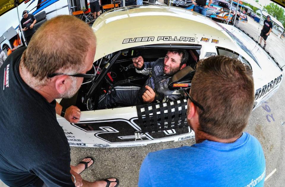 Bubba Pollard talks to his crew after a run during practice for the 41st Slinger Nationals in Wisconsin.