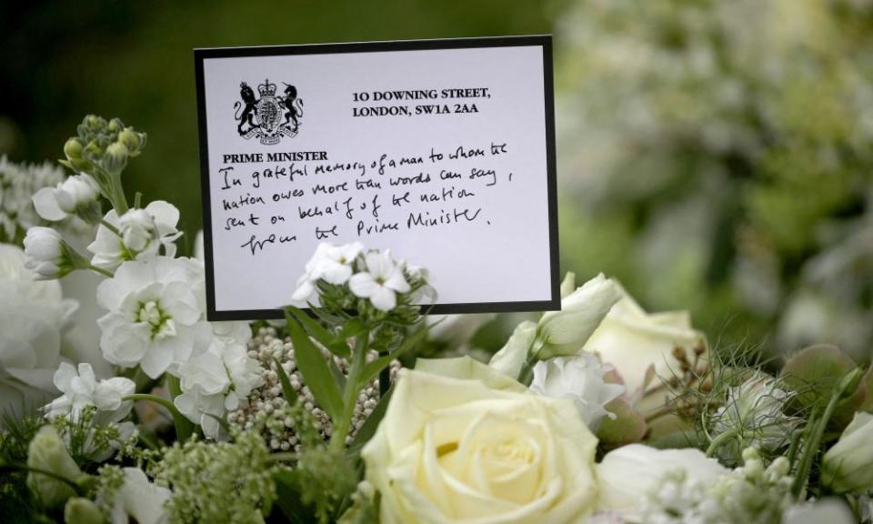 A wreath sent by Boris Johnson is among floral tributes outside St George’s chapel at Windsor Castle.