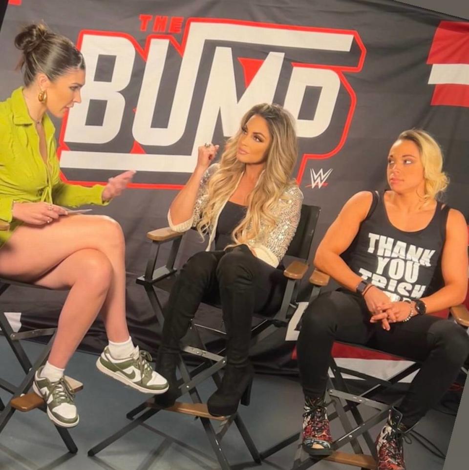 WWE Superstar Zoey Stark (seated right) and WWE Hall of Famer Trish Stratus (middle) on WWE’s “The Bump,” co-hosted by Cathy Kelley.