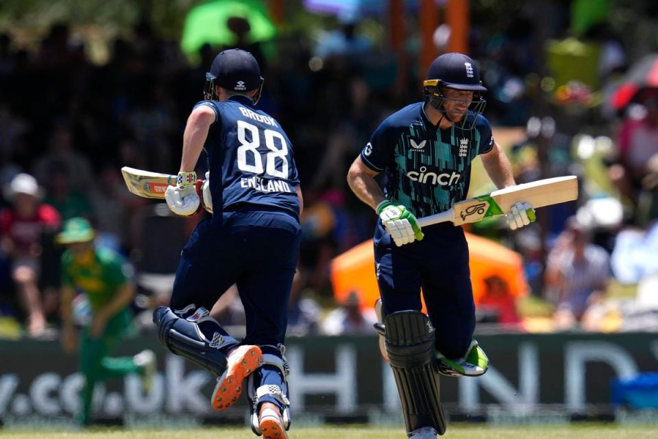 England’s captain Jos Buttler, right, with teammate Harry Brook run between the wickets, during the second One-Day International cricket match between South Africa and England at Mangaung Oval in Bloemfontein, South Africa, Sunday, Jan. 29, 2023. (AP Photo/Themba Hadebe) (AP)