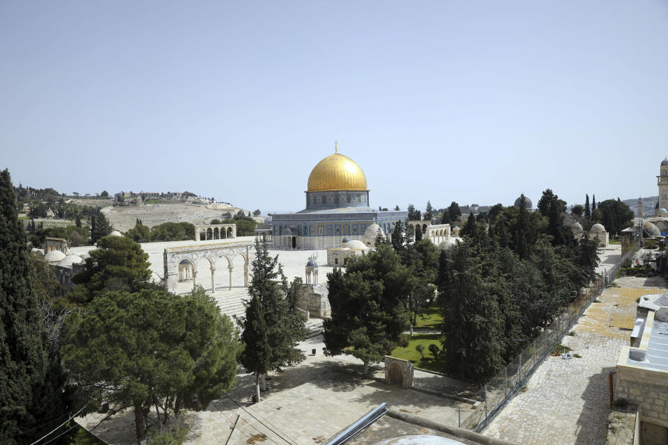 Dome of the Rock is seen at a deserted al-Aqsa mosque compound as all prayers are suspended to prevent the spread of coronavirus in Jerusalem, Monday, March 23, 2020. In Israel daily life has largely shut down with coronavirus cases multiplying greatly over the past week, (AP Photo/Mahmoud Illean)