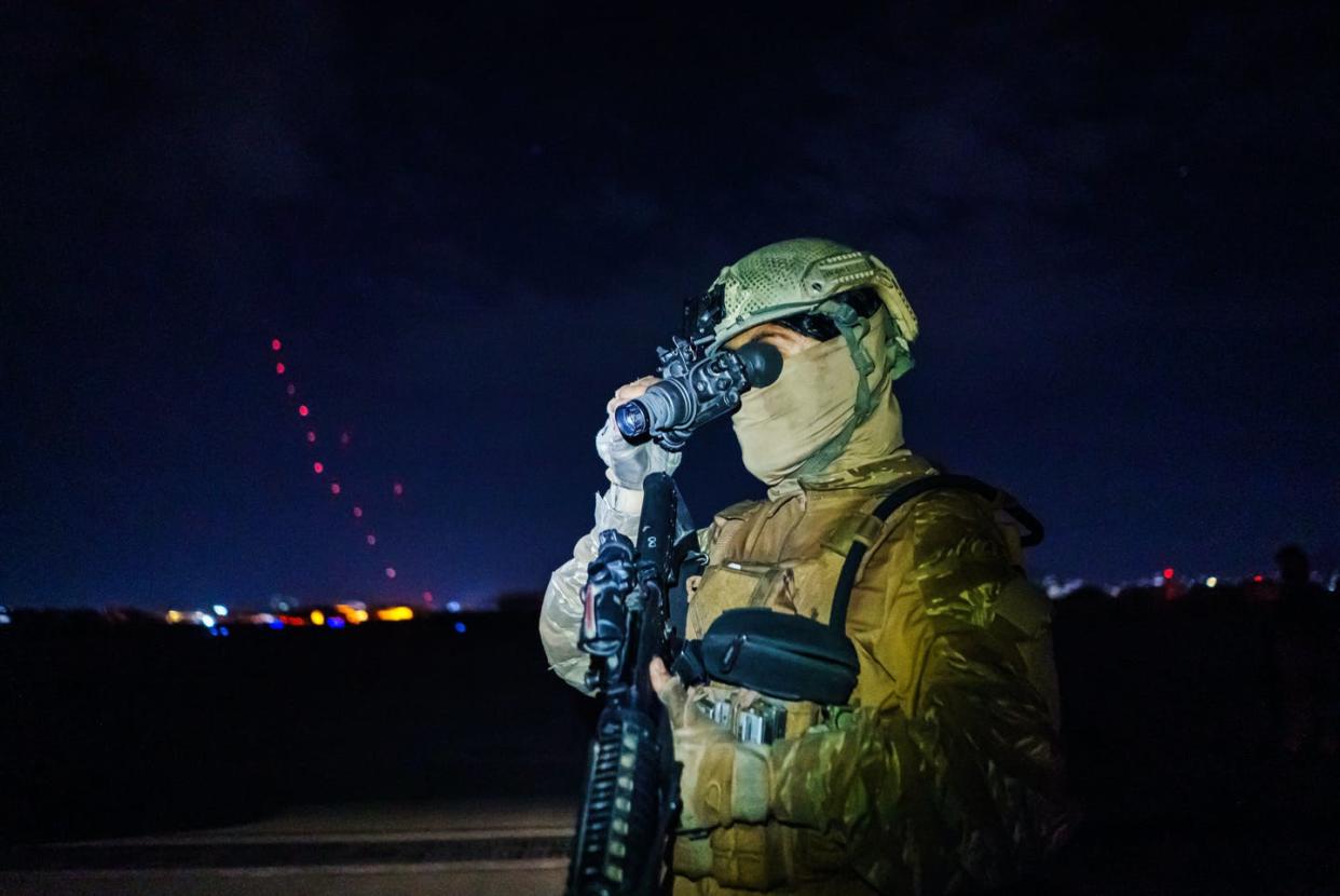 <span class="caption">A Taliban fighter, wearing U.S. clothing and carrying U.S. weapons, looks through a captured night-vision device.</span> <span class="attribution"><a class="link " href="https://www.gettyimages.com/detail/news-photo/taliban-fighters-from-the-fateh-zwak-unit-wielding-american-news-photo/1234968813" rel="nofollow noopener" target="_blank" data-ylk="slk:Marcus Yam/Los Angeles Times via Getty Images;elm:context_link;itc:0;sec:content-canvas">Marcus Yam/Los Angeles Times via Getty Images</a></span>