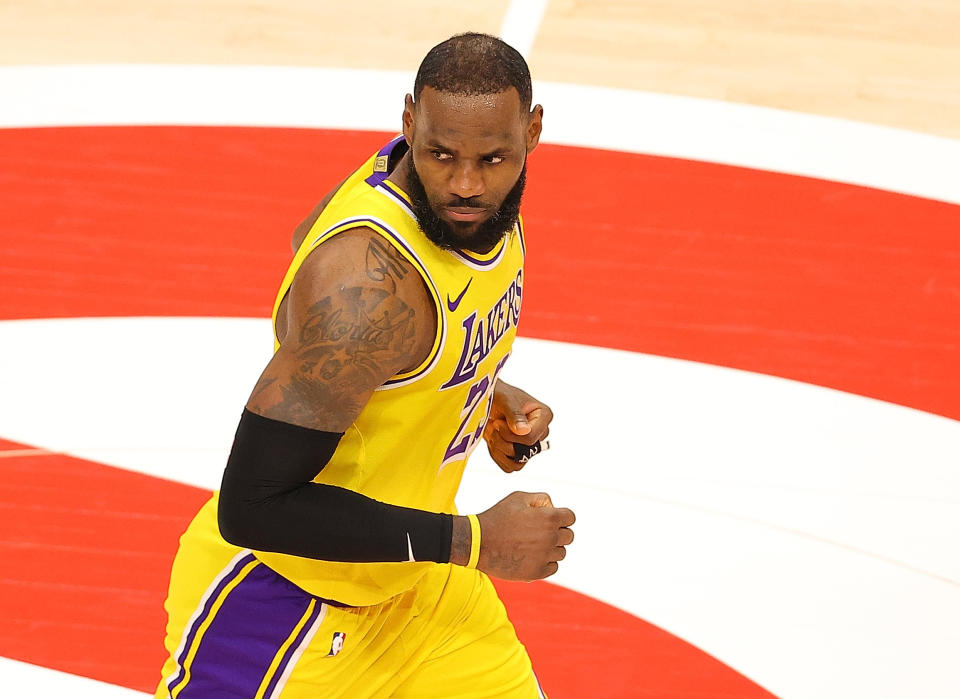 ATLANTA, GEORGIA - FEBRUARY 01:   LeBron James #23 of the Los Angeles Lakers reacts after hitting a three-point basket against the Atlanta Hawks during the second half at State Farm Arena on February 01, 2021 in Atlanta, Georgia.  NOTE TO USER: User expressly acknowledges and agrees that, by downloading and or using this photograph, User is consenting to the terms and conditions of the Getty Images License Agreement.  (Photo by Kevin C. Cox/Getty Images)