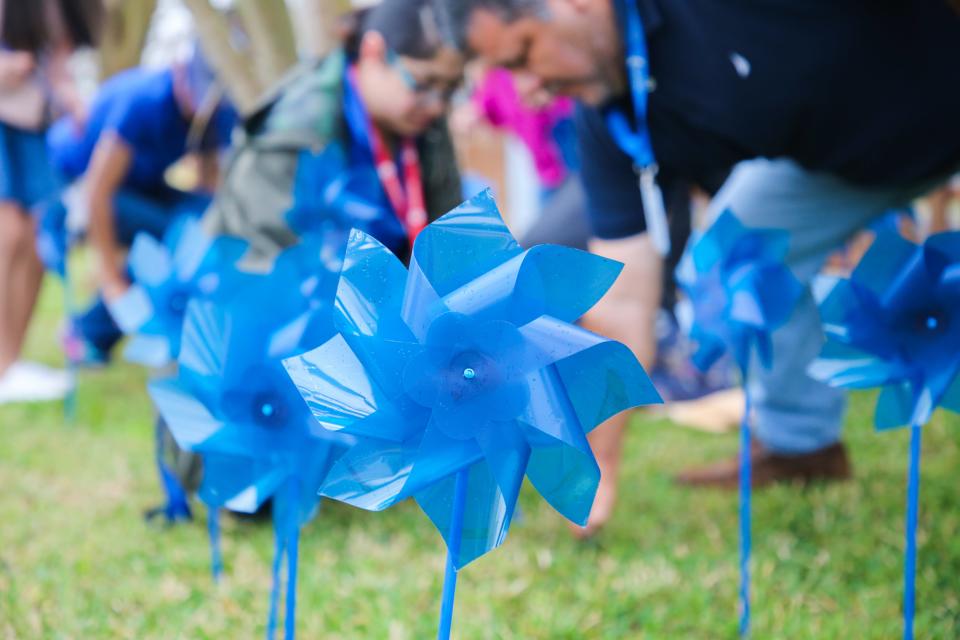 Members of Education Service Center Region 2, BCFS Health & Human Services of Corpus Christi and CASA of the Coastal Bend plant 300 pinwheels Wednesday, March 30, 2022. The pinwheels represent victims of child abuse and neglect.