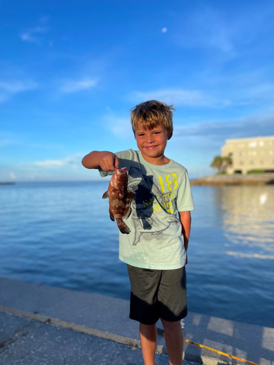 Rylee Rex with a catch and release red grouper caught in the backwaters of Naples.
