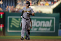 Pittsburgh Pirates shortstop Kevin Newman rounds second base after hitting a home run against the Washington Nationals during the first inning of a baseball game, Monday, June 14, 2021, in Washington. (AP Photo/Carolyn Kaster)