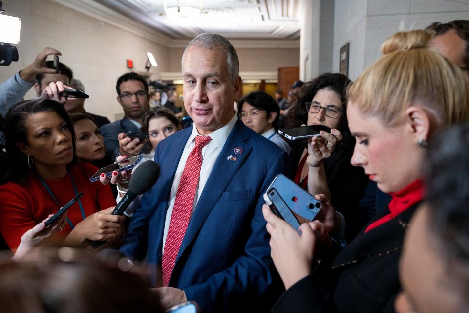 Rep. Mario Diaz-Balart, R-Fla., speaks to reporters outside of a GOP caucus meeting working to formally elect a new speaker of the House last October.