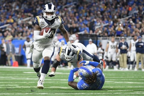 Los Angeles Rams running back Todd Gurley (30) runs for a touchdown during the second half against the Detroit Lions at Ford Field - Credit: Tim Fuller/USA TODAY
