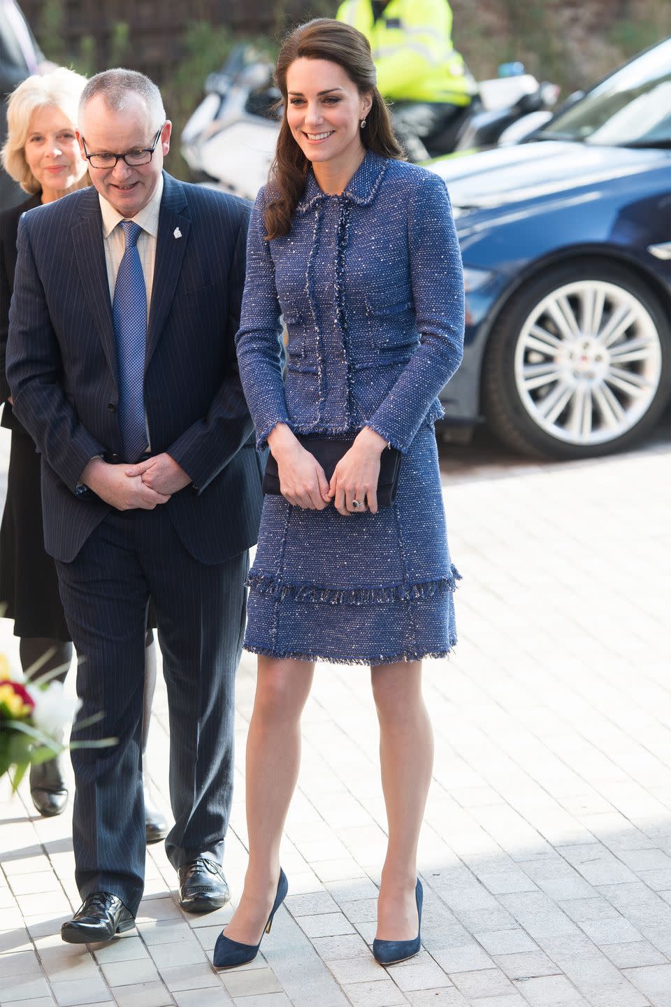 <p>Middleton wears a blue tweed skirt suit with fringe details by Rebecca Taylor with a dark navy clutch and suede pumps while visiting Ronald McDonald House Evelina London.</p>