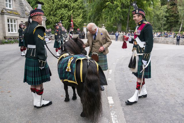 <p>Jane Barlow/PA Images via Getty</p> King Charles and Corporal Cruachan IV at Balmoral Castle on August 21, 2023