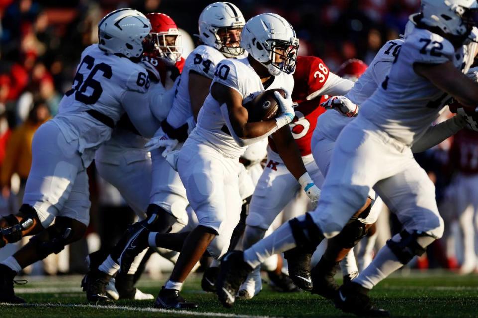 Penn State running back Nicholas Singleton (10) rushes against Rutgers during the first half of an NCAA college football game Saturday, Nov. 19, 2022, in Piscataway, N.J.