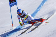 United States' Mikaela Shiffrin speeds down the course during an alpine ski, women's World Cup super-G, in Lenzerheide, Switzerland, Saturday, March 5, 2022. (AP Photo/Alessandro Trovati)