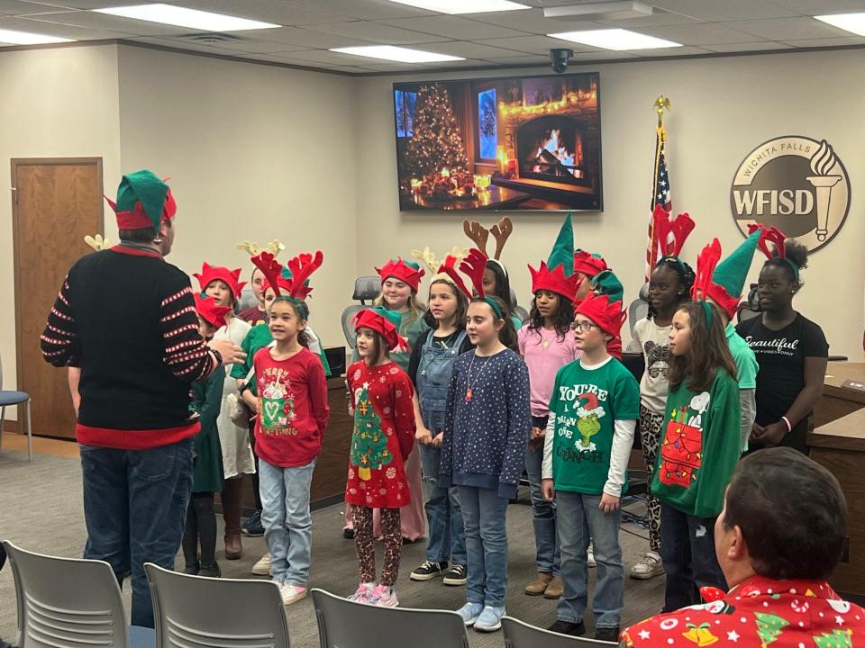 The Milam Elementary School Choir fills the Wichita Falls ISD Boardroom with the sound of Christmas during the district's holiday open house Wednesday, Dec. 13, 2023.