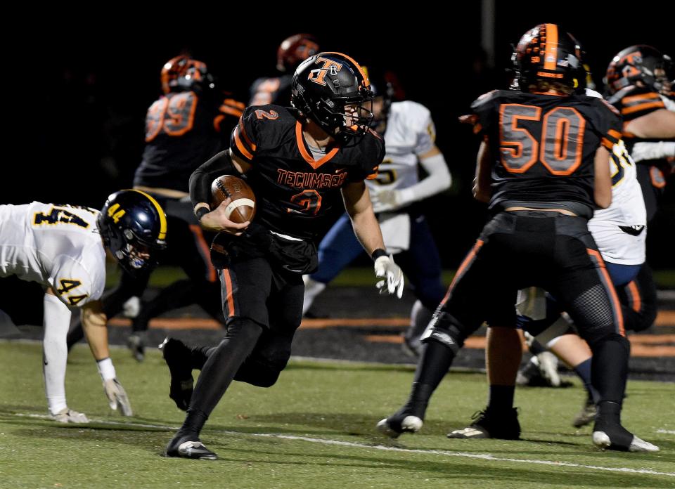 Tecumseh quarterback Jacob Burns looks for running room during a 52-28 win over Airport in the opening round of the Division 4 state playoffs Friday night.