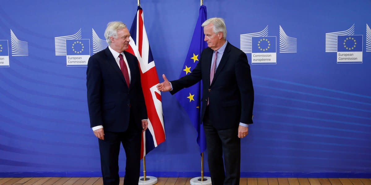 The European Union's chief Brexit negotiator Michael Barnier (R) welcomes Britain's Secretary of State for Exiting the European Union David Davis at the European Commission ahead of their first day of talks in Brussels, June 19, 2017.