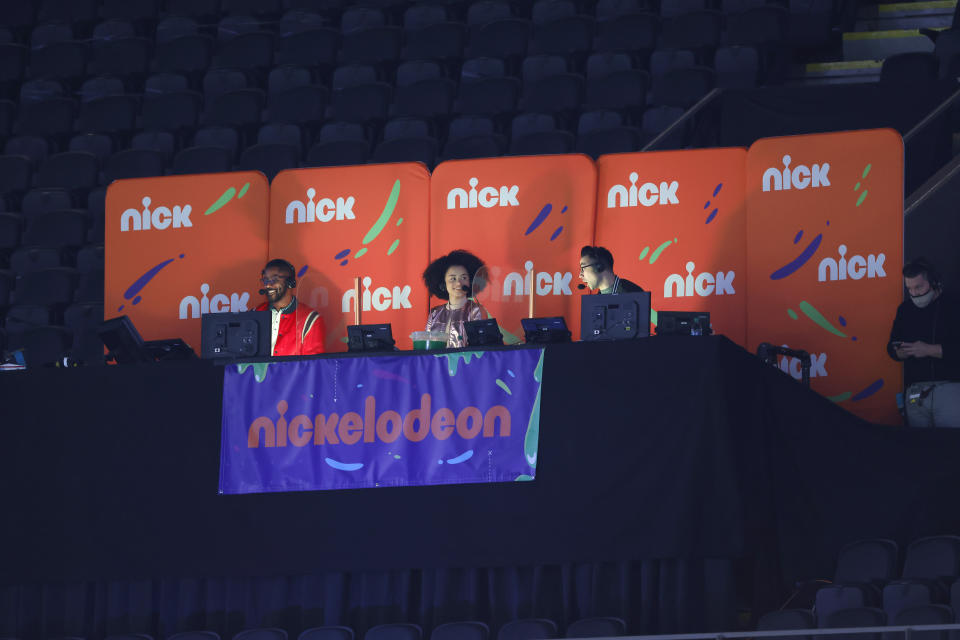 FILE - Nickelodeon commentators, from left, Nate Burleson, Gabrielle Nevaeh Green and Noah Eagle are seen during an NFL wild-card playoff football between the New Orleans Saints and the Chicago Bears, Jan. 10, 2021, in New Orleans. Nickelodeon will air its fifth NFL game on Sunday, Feb. 11, 2024, when the Kansas City Chiefs face the San Francisco 49ers for the Vince Lombardi Trophy, and it will mark the first alternate broadcast of a Super Bowl game. (AP Photo/Tyler Kaufman, File)