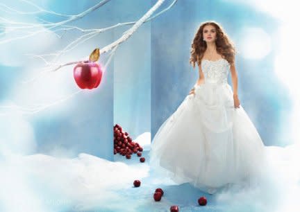 <div class="caption-credit"> Photo by: Alfred Angelo</div><div class="caption-title">Princess Snow White</div>Capturing Snow White's gentle grace and beauty, and inspired by nature, this net-over-satin ballgown features a lace bodice of organza apple blossoms with shimmering rhinestone and crystal centers and a skirt with scattered blossom detail. A lovely satin sash and back bow make a graceful finish. <br> <a href="http://www.babble.com/mom/2013-disneys-fairy-tale-weddings-dresses/?cmp=ELP|bbl|lp|YahooShine|Main||030413|||famE|||" rel="nofollow noopener" target="_blank" data-ylk="slk:Get the dress here;elm:context_link;itc:0;sec:content-canvas" class="link "><i>Get the dress here</i></a>